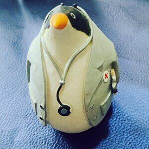 Penguins going to work. Six Miniature tradesmen, a doctor, postman, fireman, etc